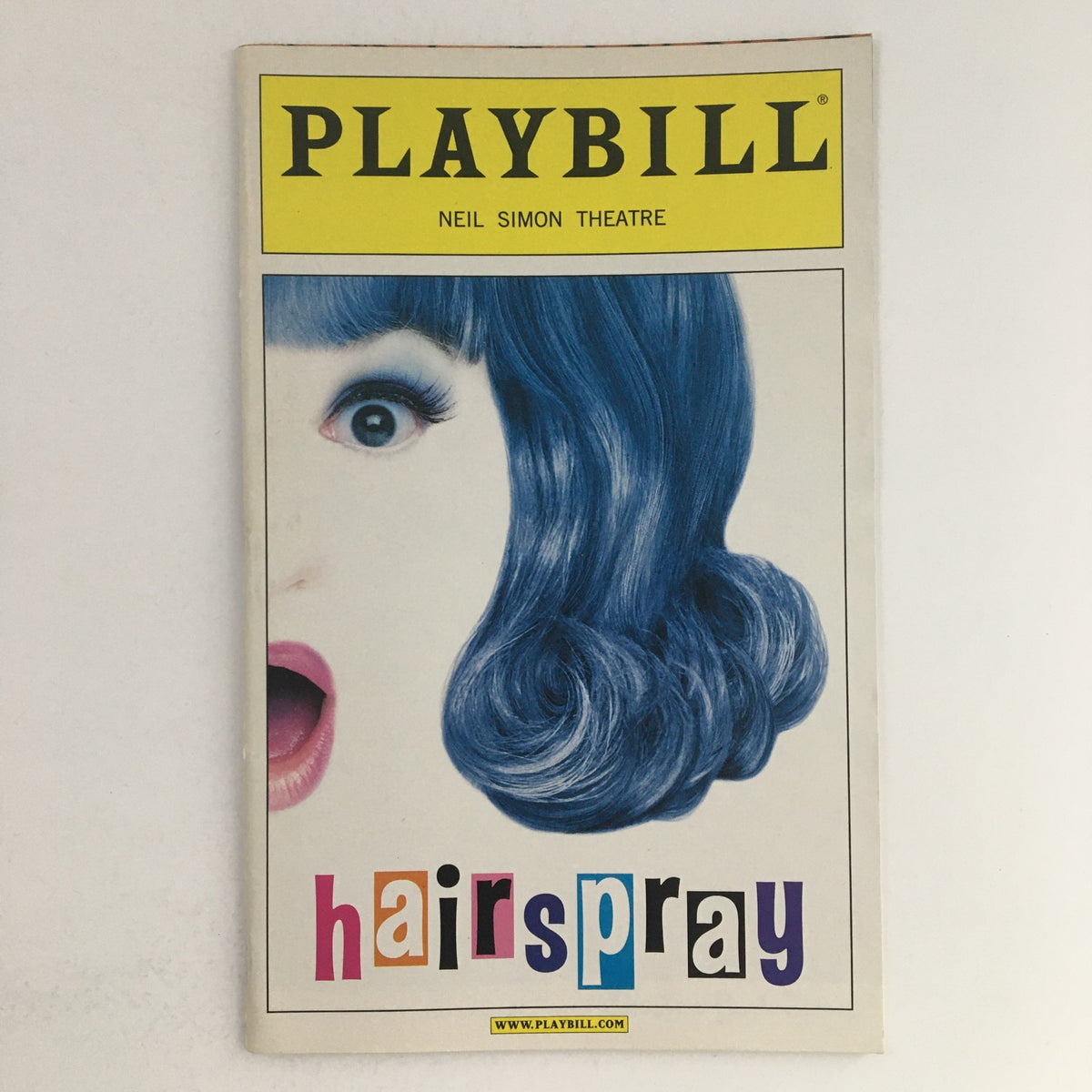 2002 Playbill for Hairspray at Neil Simon Theatre featuring a vibrant blue-haired character on the cover.