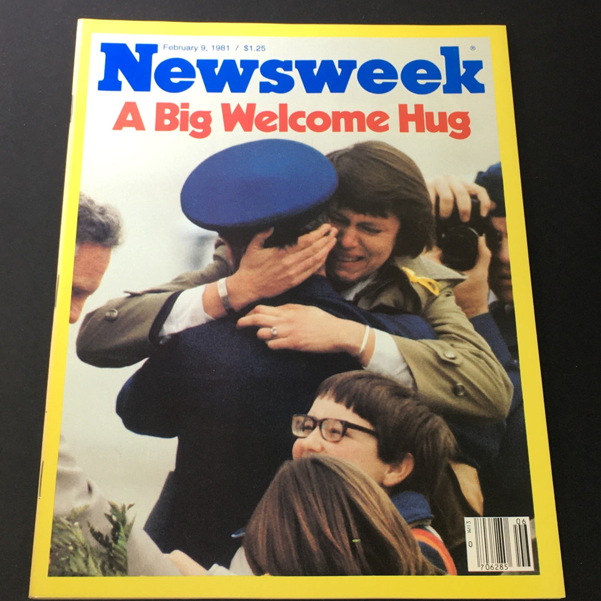 Cover of Newsweek magazine from February 9, 1981, featuring the title 'A Big Welcome Hug.' The image captures an emotional scene of a soldier embracing a woman, surrounded by children and bystanders, highlighting themes of joy and reunion.