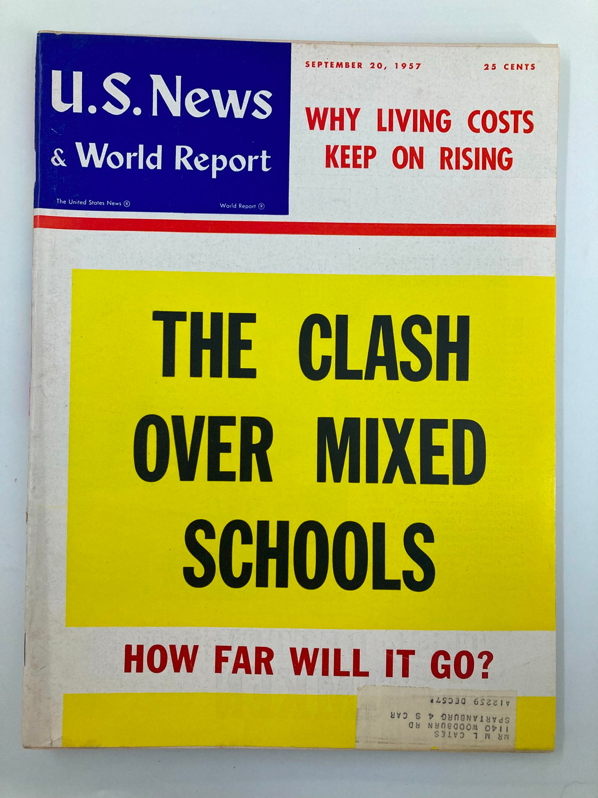 Cover of US News & World Report Magazine from September 20, 1957, featuring the title 'The Clash Over Mixed Schools' with bold yellow lettering against a white background, exploring the topic of racial integration in education.