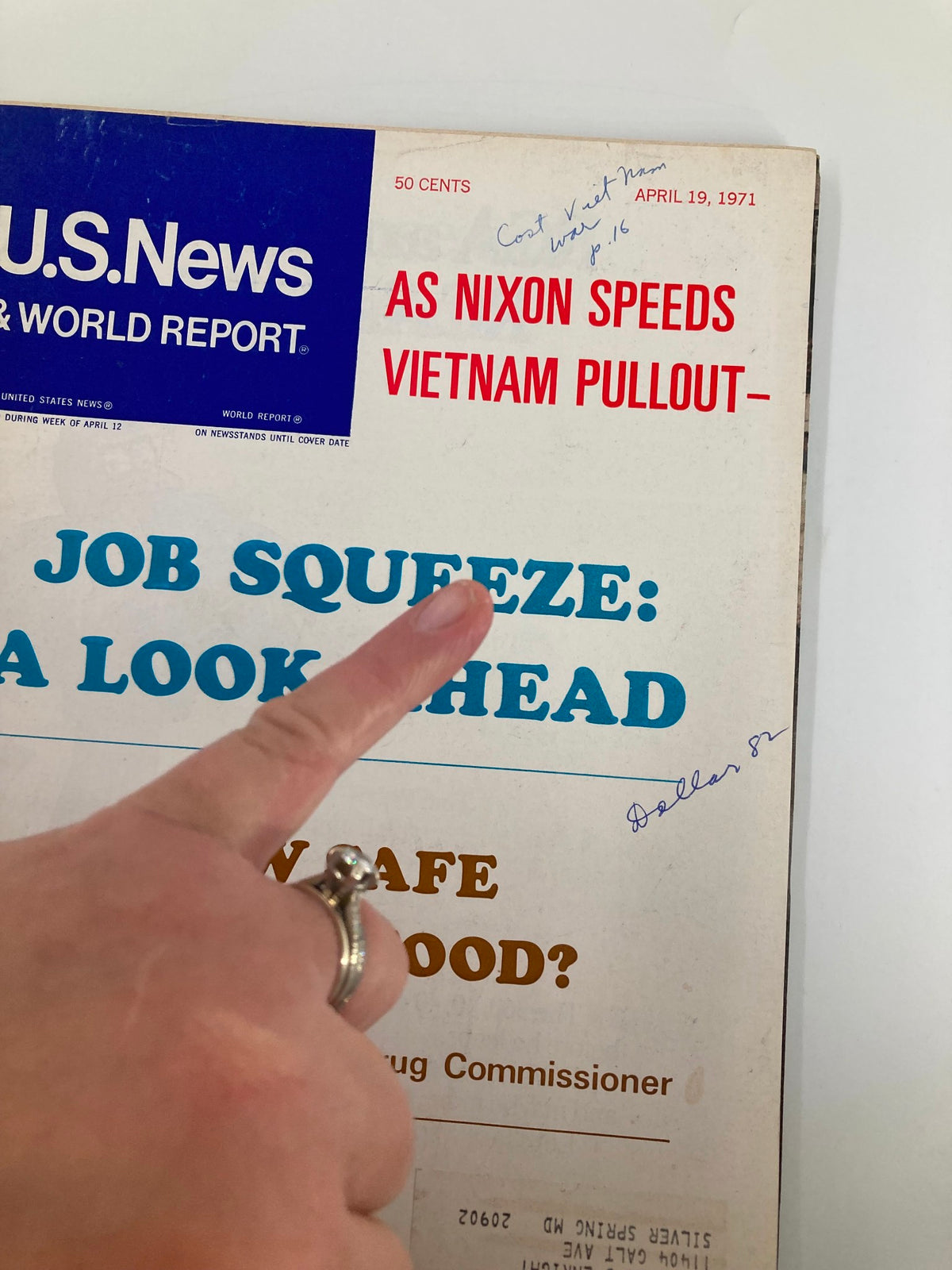 Close-up of the US News & World Report Magazine cover from April 19, 1971, highlighting the article 'Job Squeeze: A Look Ahead' with a finger pointing at the text.