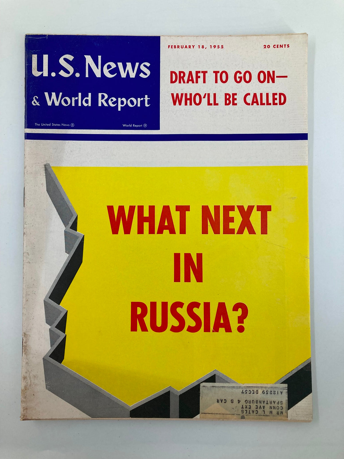 Cover of US News & World Report magazine from February 18, 1955, featuring the headline 'Draft To Go On - Who'll Be Called?' and a striking yellow background with the question 'What Next In Russia?'