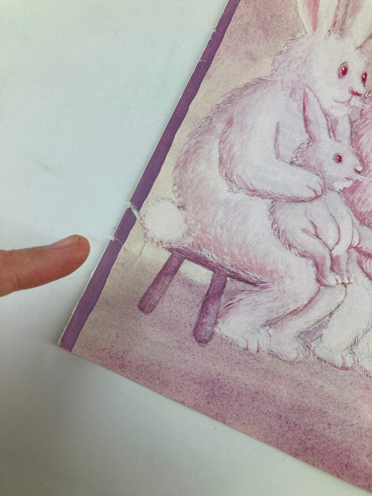 Close-up of a minor rip on the edge of the COVER ONLY The New Yorker April 4 1983 Bunny Family by Chas Addams magazine cover, showcasing the whimsical Bunny Family illustration.