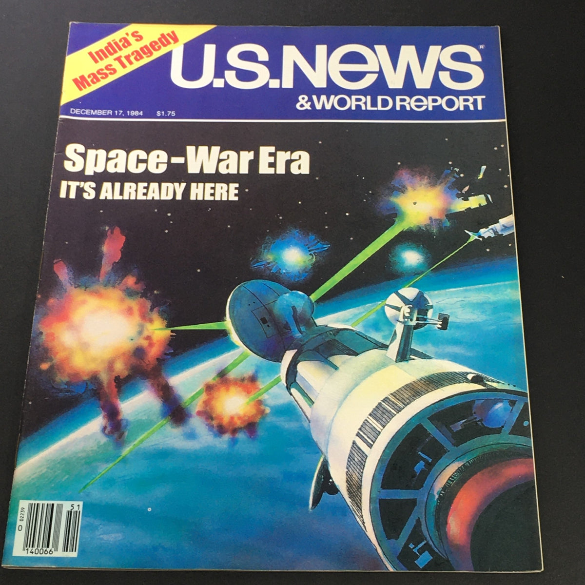 Vintage U.S. News & World Report magazine cover from December 17, 1984, titled 'Space-War Era: It's Already Here'. The cover features a vibrant illustration of a spacecraft in space amidst explosions and cosmic rays, highlighting themes of space technology and military advancements during the 1980s.