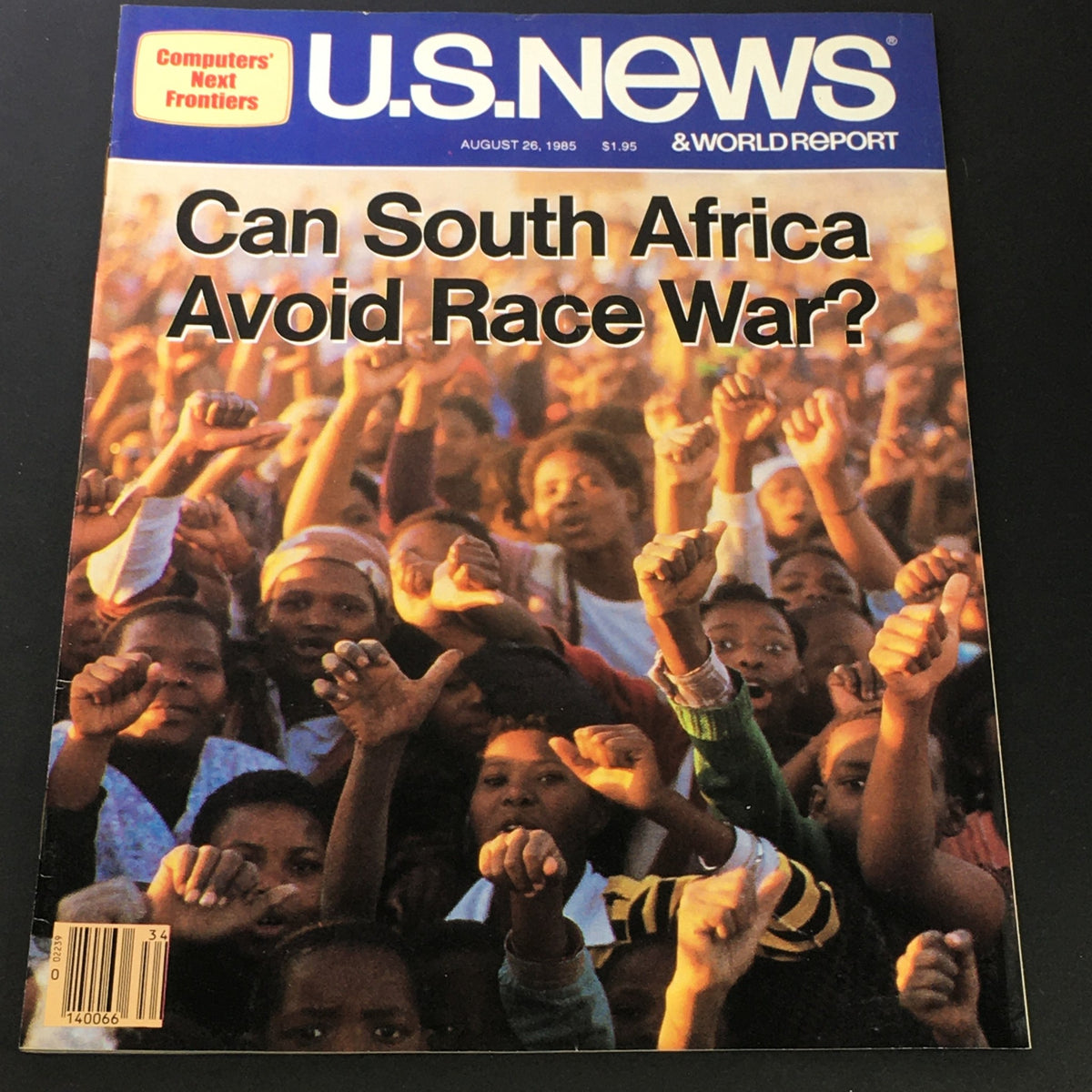 Cover of US News & World Report dated August 26, 1985 featuring the question 'Can South Africa Avoid Race War?' with a powerful visual of people raising their fists, symbolizing resistance and social unrest.