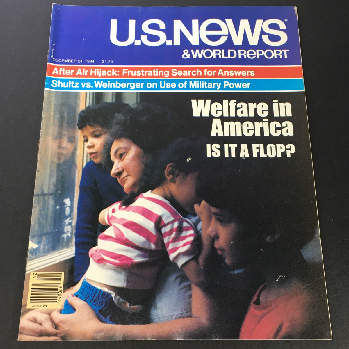 Cover of VTG US News & World Report from December 24, 1984, featuring the title 'Welfare in America: Is It a Flop?' with images of children, and highlights the discussion between Howard Schultz and Caspar Weinberger.