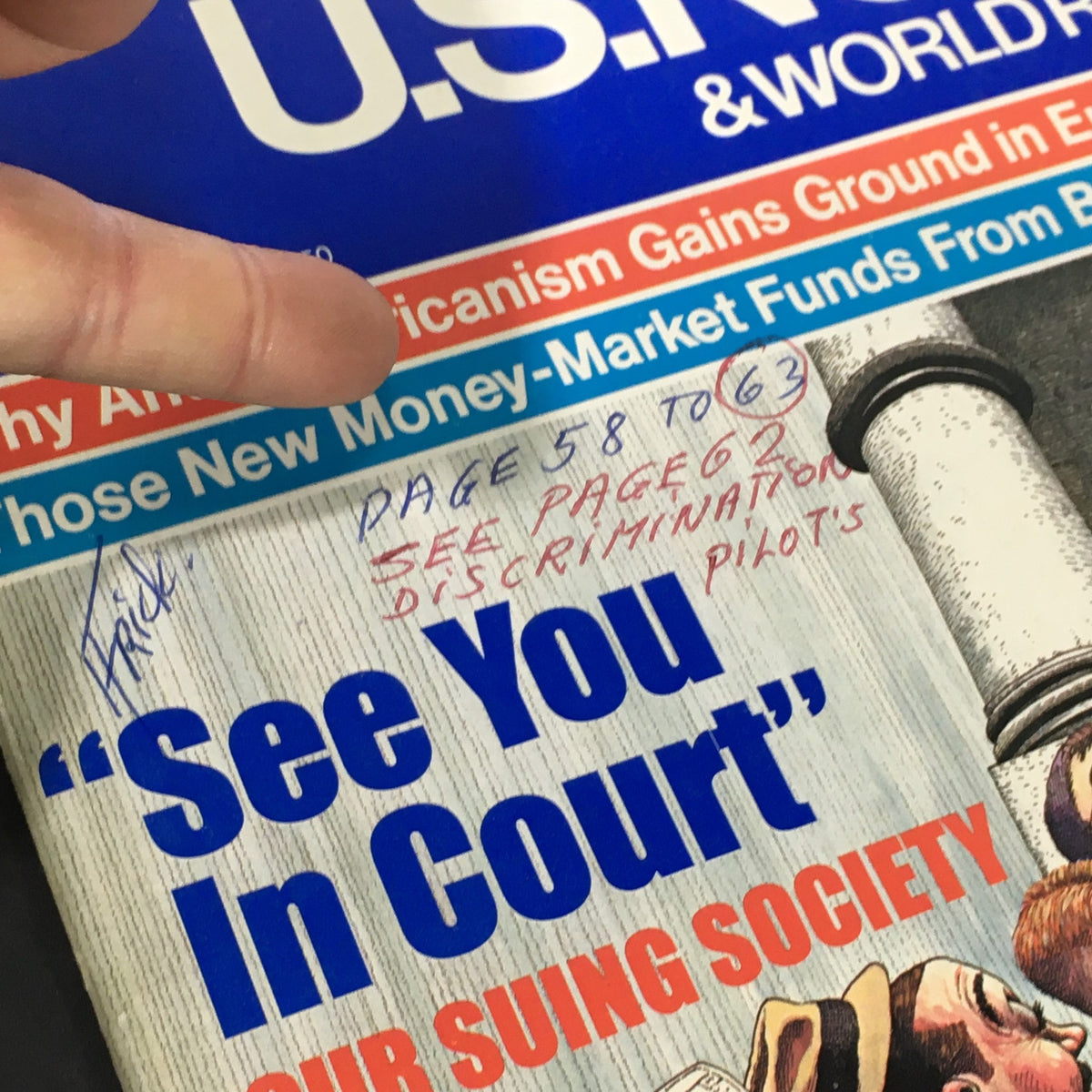 Close-up of the U.S. News & World Report cover from December 20, 1982, showing handwritten notes referencing page numbers related to discrimination lawsuits.