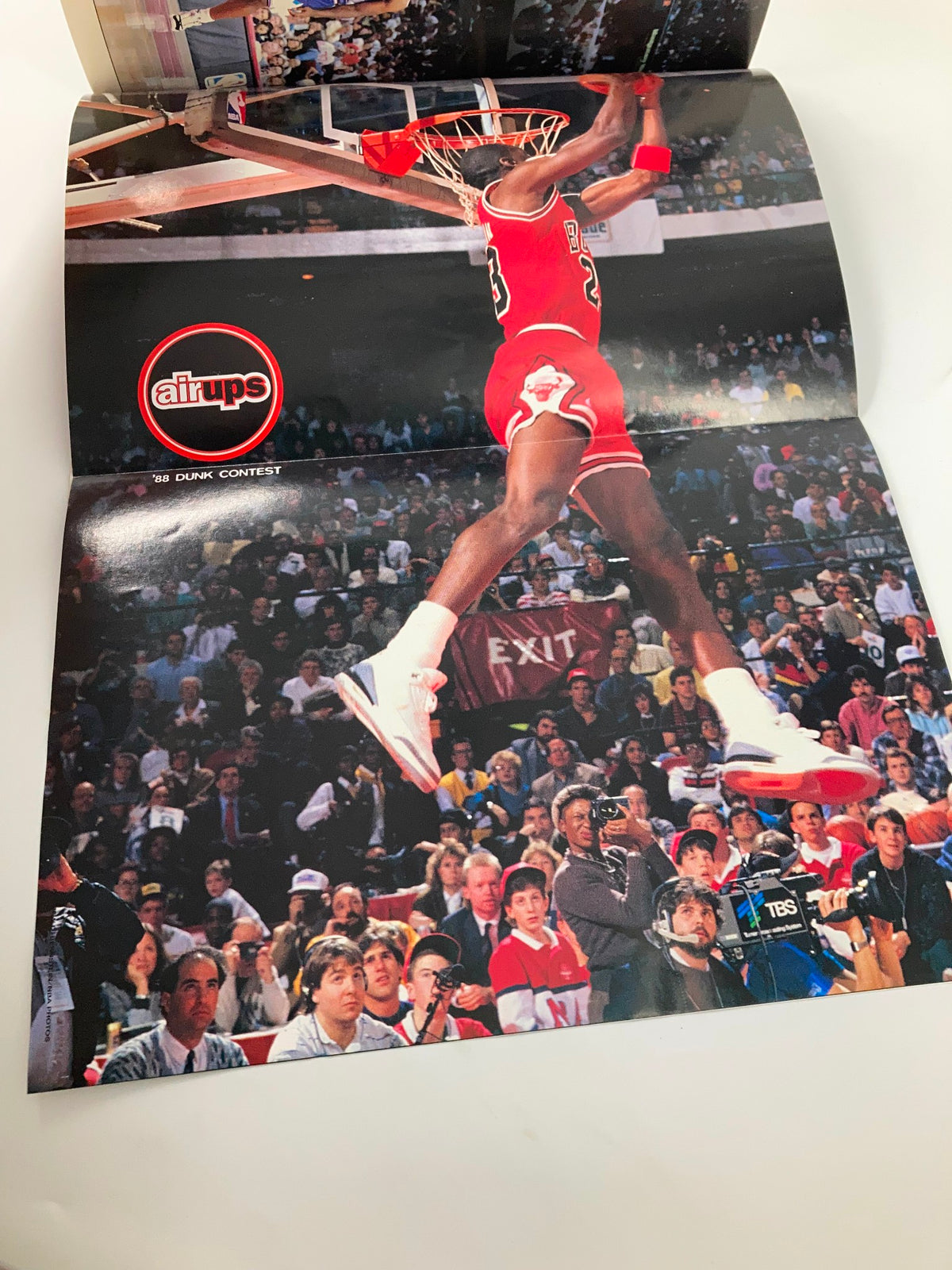 Inside fold-out poster from Slam Magazine Presents 1997 #20 depicting Michael Jordan performing a slam dunk during the 1988 Dunk Contest, with fans visible in the background.
