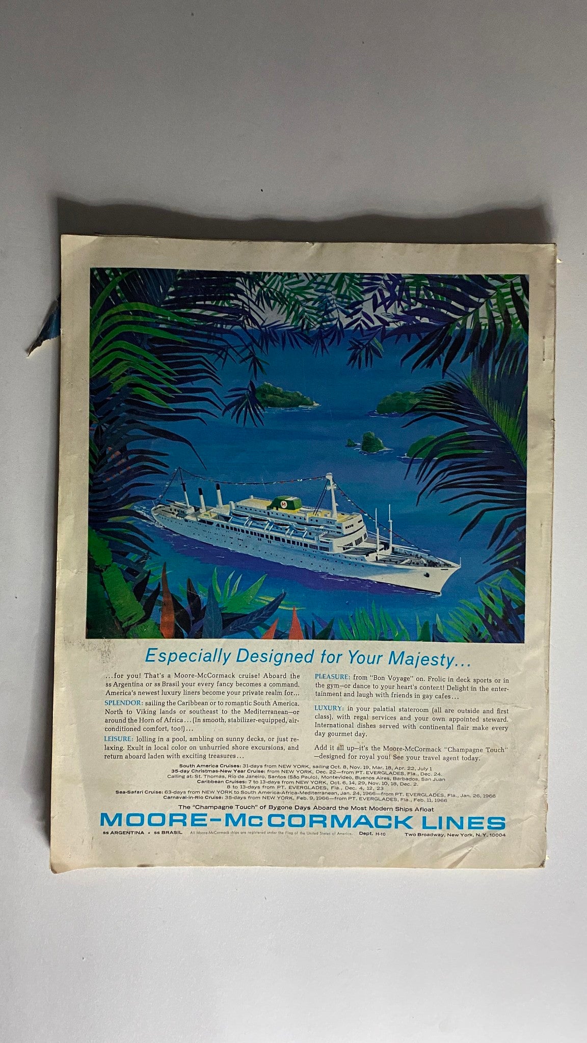 Back cover of VTG Holiday Magazine October 1965 displaying an advertisement for Moore-McCormack Lines featuring a colorful illustration of a cruise ship surrounded by tropical scenery.