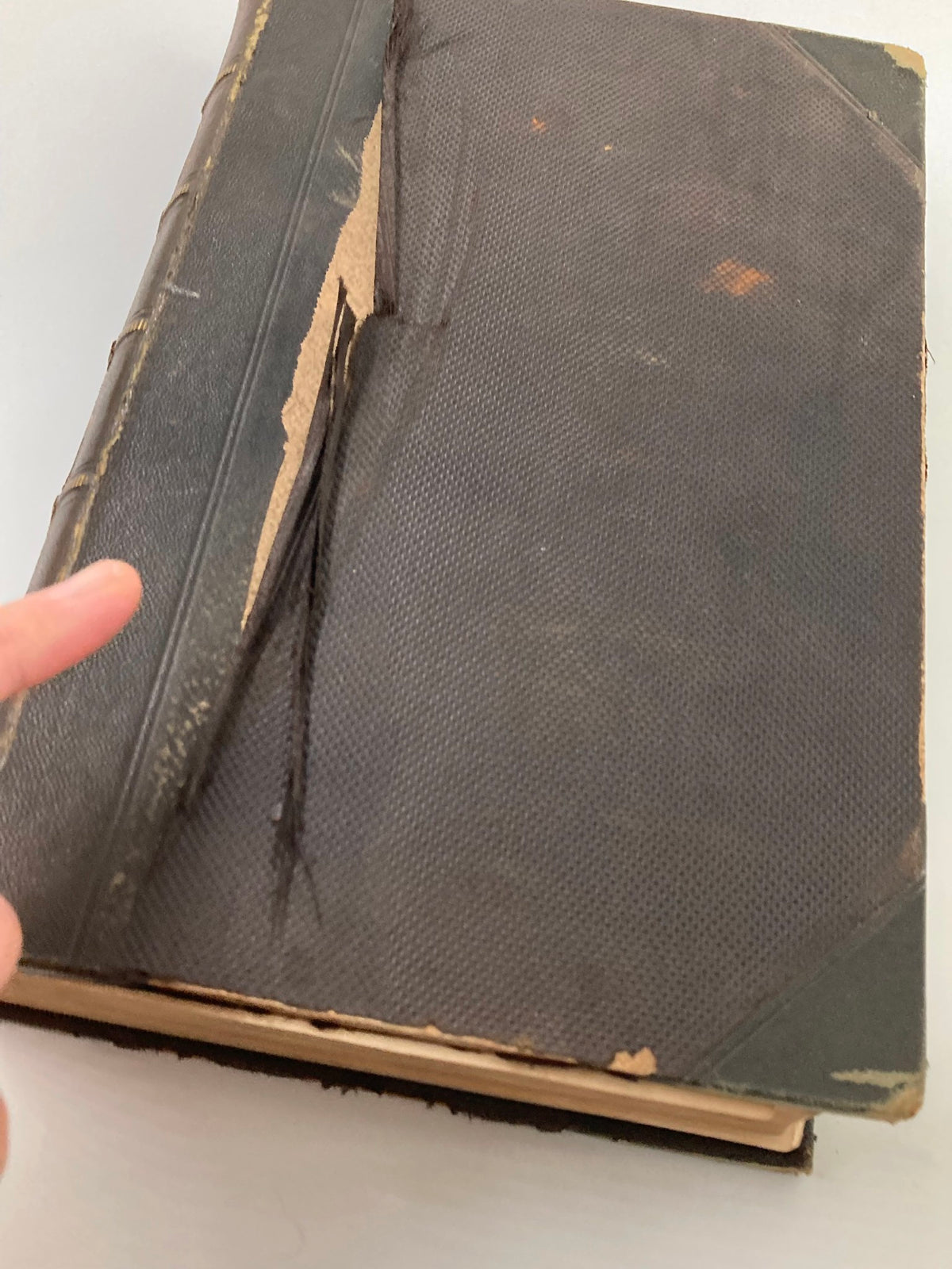 Close-up of the damaged cover of VTG Harper's New Monthly Magazine Volume XX, showcasing wear and tear indicative of its vintage condition.