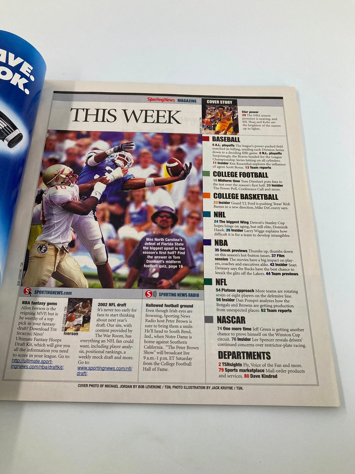 Inside page of The Sporting News Magazine from October 22, 2001, displaying articles and features related to various sports, including basketball, football, and college sports.