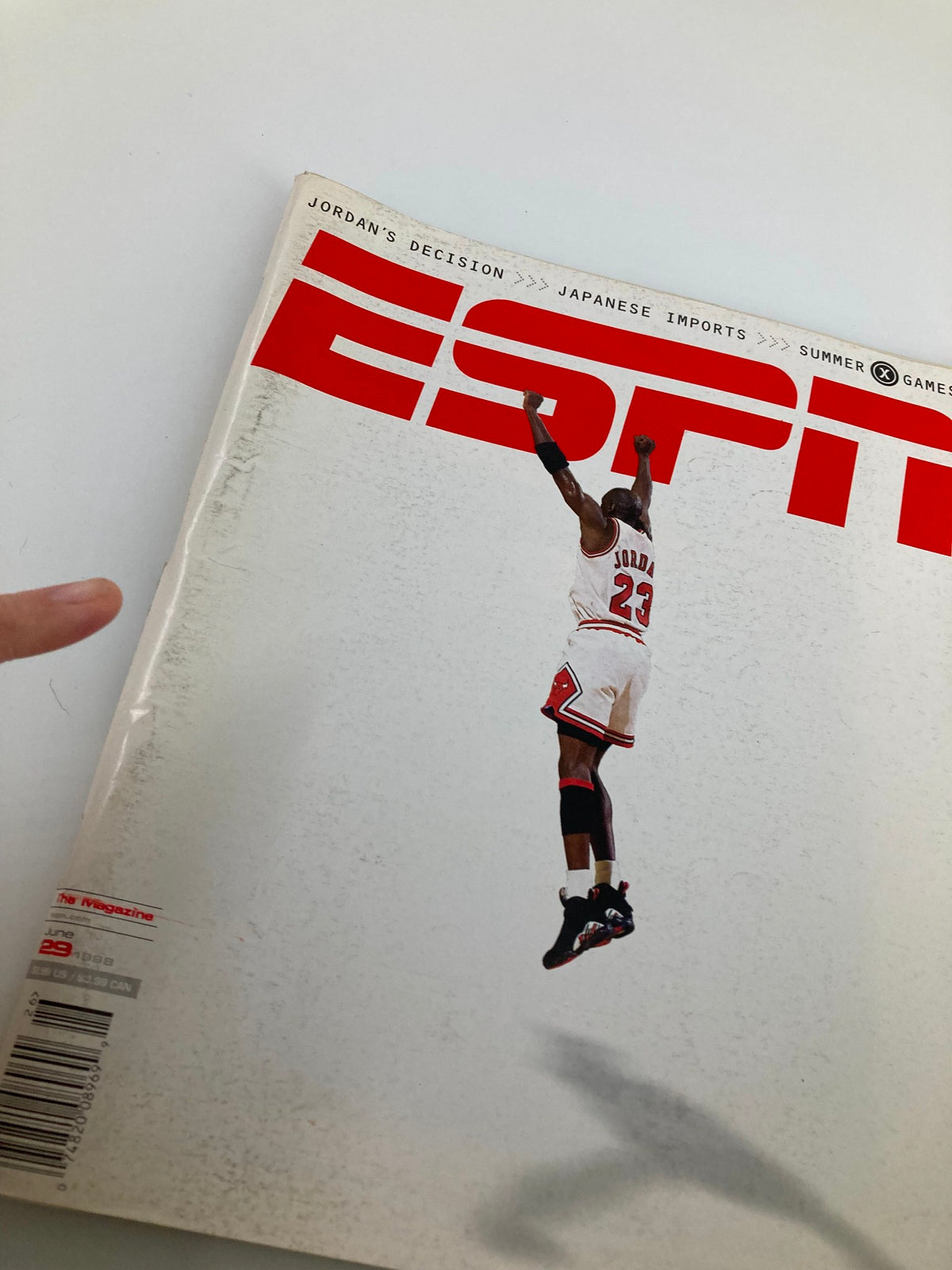 Detailed view of the cover of ESPN The Magazine from June 29, 1998, highlighting Michael Jordan's jump and the magazine's title with a focus on sports themes including Japanese imports.