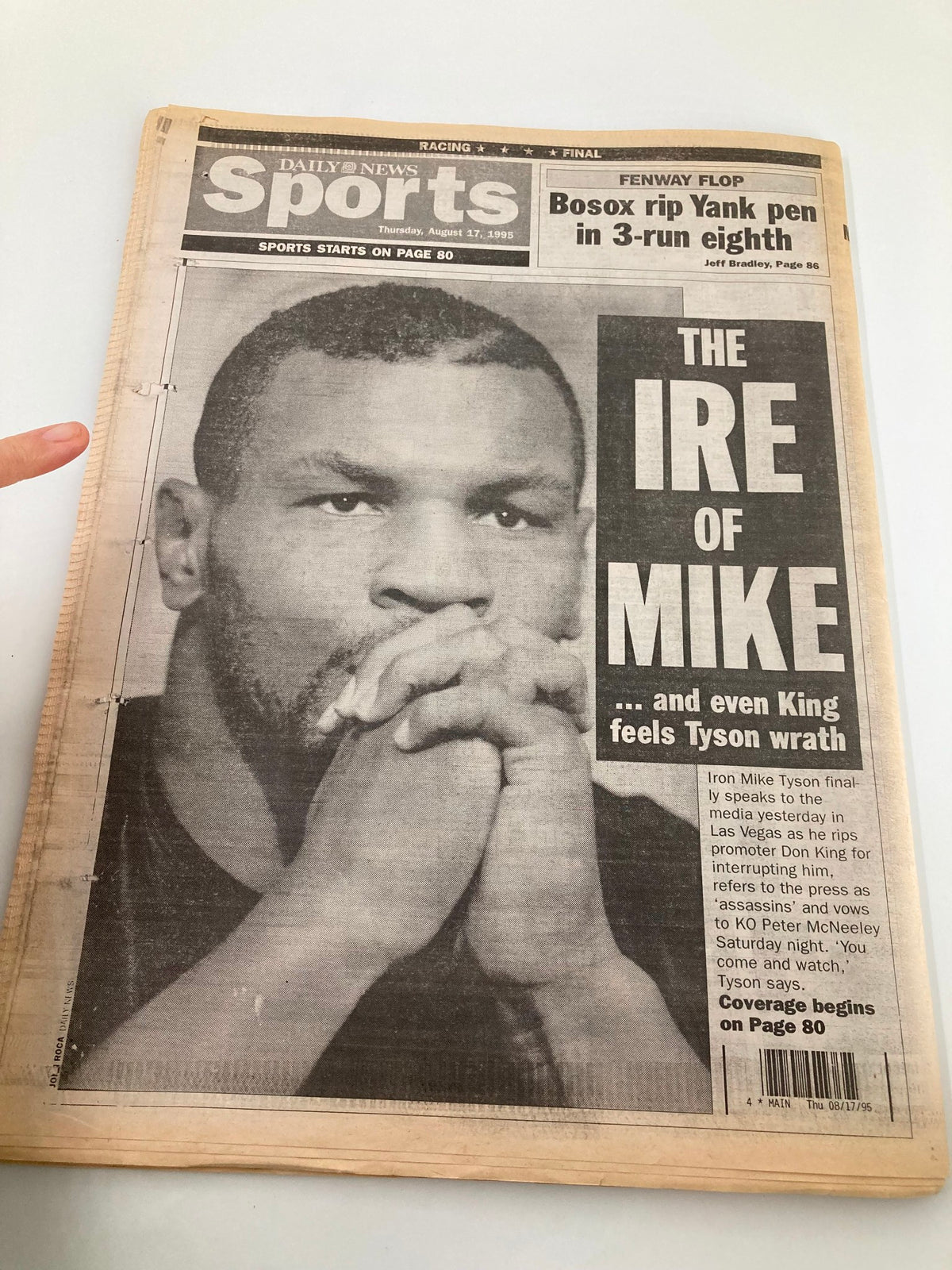 Daily News Sports section from August 17 1995 featuring Mike Tyson with the headline 'THE IRE OF MIKE,' covering Tyson's press remarks and upcoming fight.