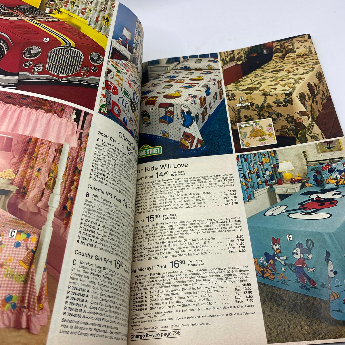 1977 JCPenney Fall and Winter Catalog featuring colorful children's bedding and themed prints, including characters from popular cartoons with detailed pricing.