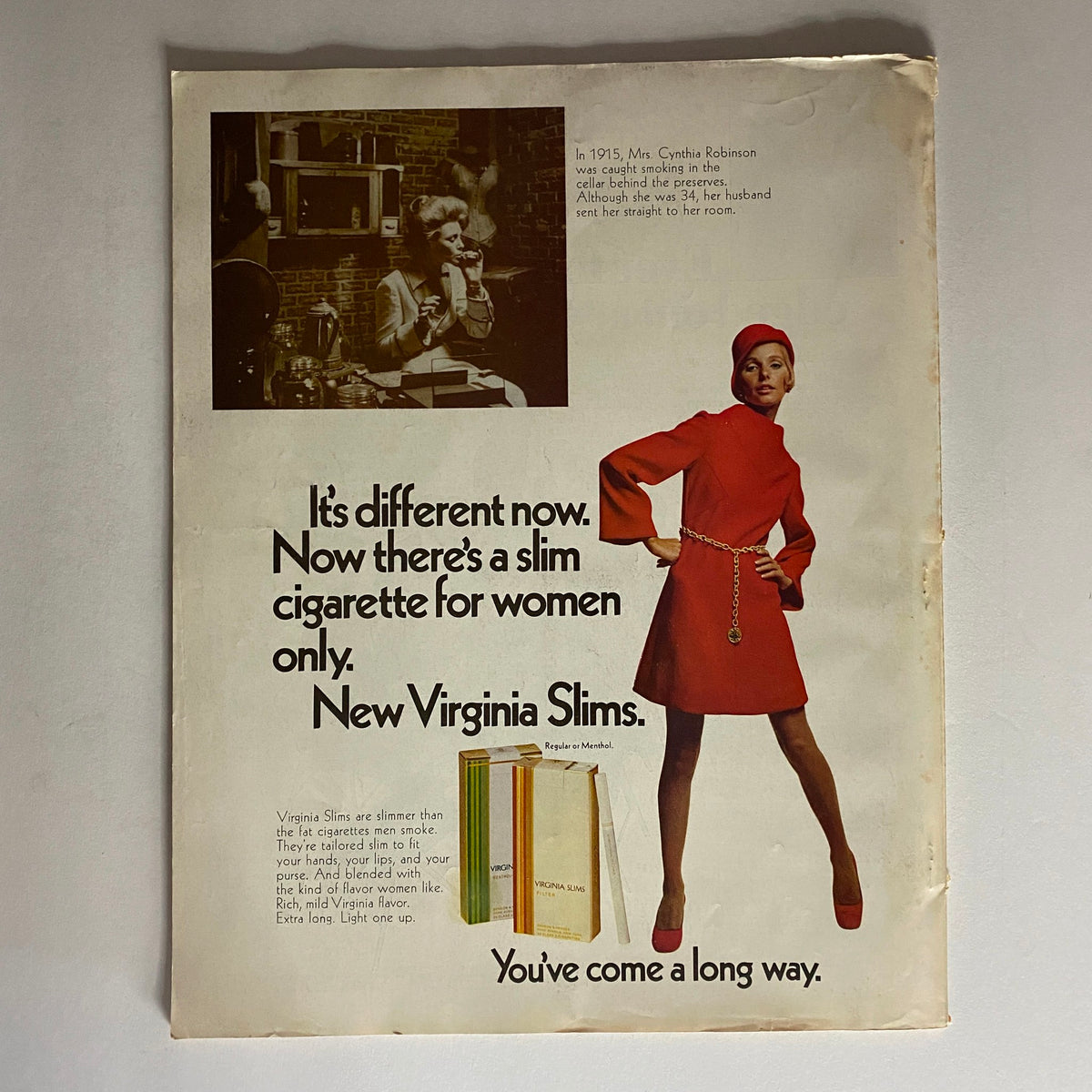 Vintage advertisement for Virginia Slims cigarettes featuring a woman in a stylish red dress, promoting the concept of slim cigarettes for women, illustrated with cigarette packs and a nostalgic design, from the VTG American Home Magazine December 1968 titled 'Our Stories of Christmas'.