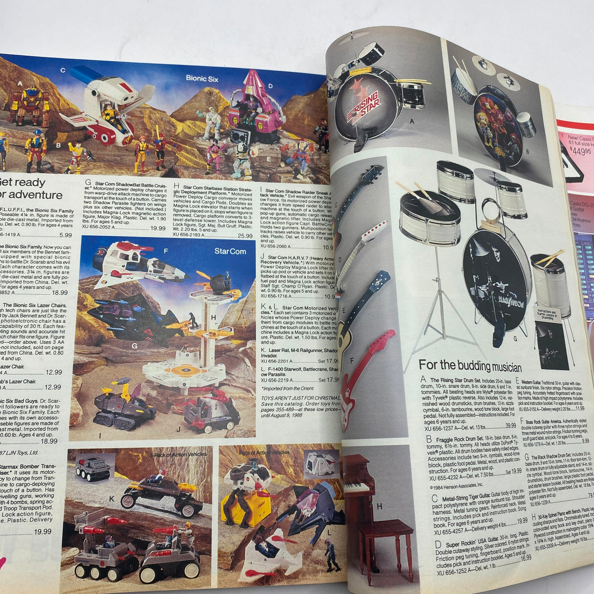 Interior page of the 1987 JCPenney Christmas Sophisticated Shimmer Catalog that includes action toys from the Bionic Six and StarCom series, showcasing imaginative play items for children.