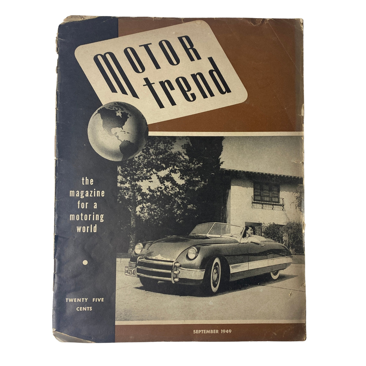 Motor Trend Magazine September 1949 cover featuring a classic car, emphasizing its title 'Motor Trend' and showcasing the theme of automotive enthusiasm.
