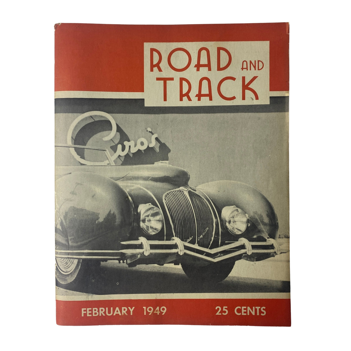 Cover of Road and Track Magazine, February 1949, featuring a classic car, highlighting the Pikes Peak Hill Climb, in good condition. Vintage automotive journalism issue.