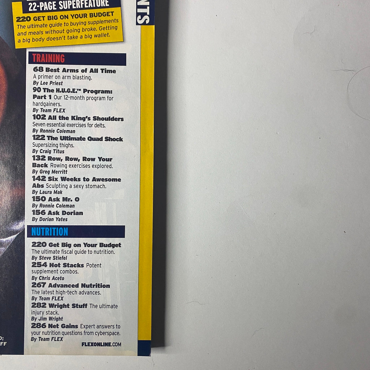 Inside page of Flex Magazine November 2002 showcasing training and nutrition tips including 'Best Arms of All Time' and 'Get Big on Your Budget'.