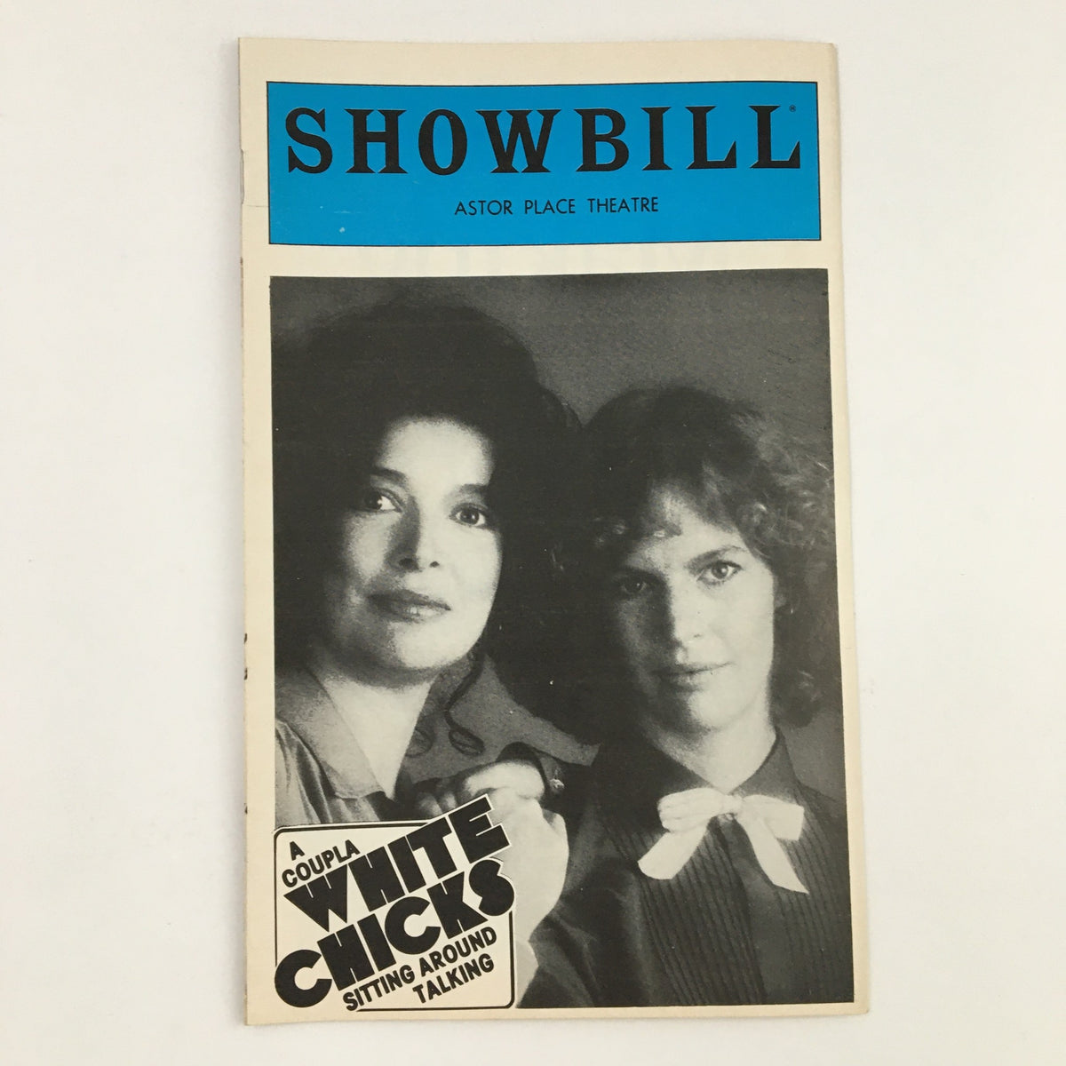 1980 Showbill for Astor Place Theatre featuring A Coupla White Chicks Sitting Around Talking. The cover depicts two women in black and white, emphasizing the theatrical production.