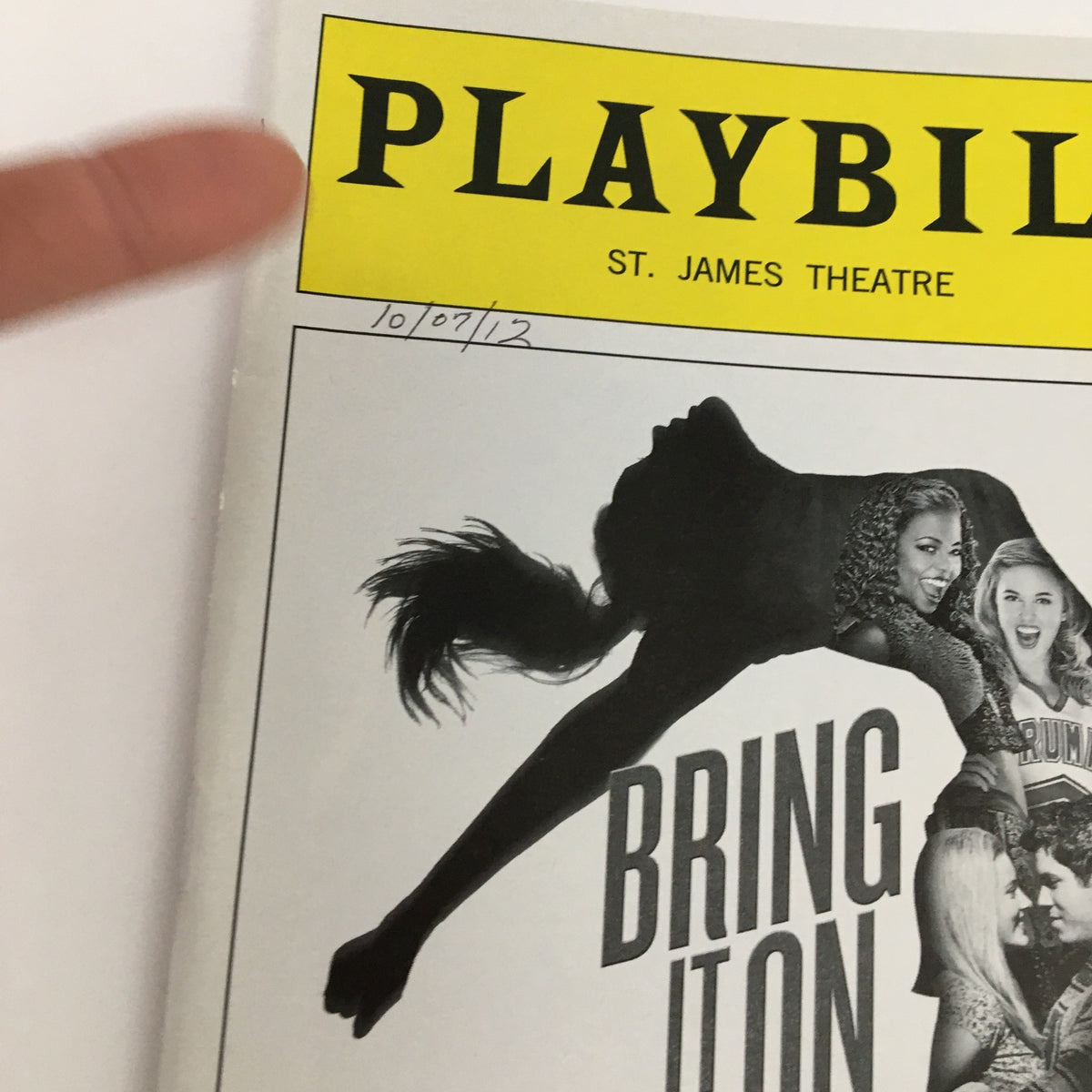 Close-up of the 2012 Playbill for Bring It On: The Musical showcasing the title and vibrant imagery.
