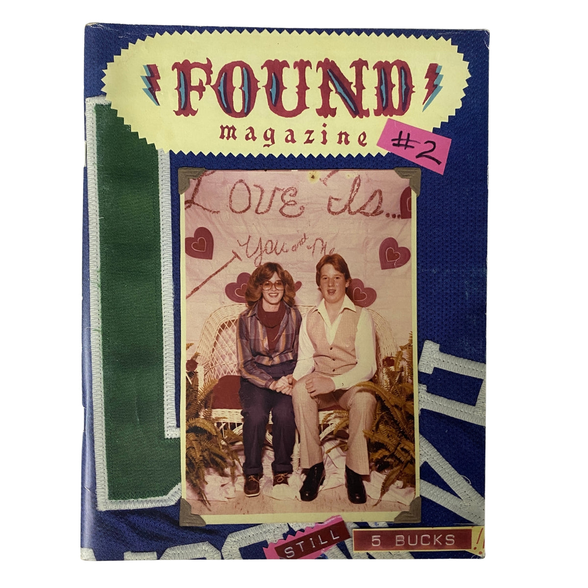 Cover of Found Magazine 2002 #2 featuring a vintage photo of two people sitting together with the text 'Love this. You & Me' and highlighted with a pink tag. Good condition publication from Original Magazines.