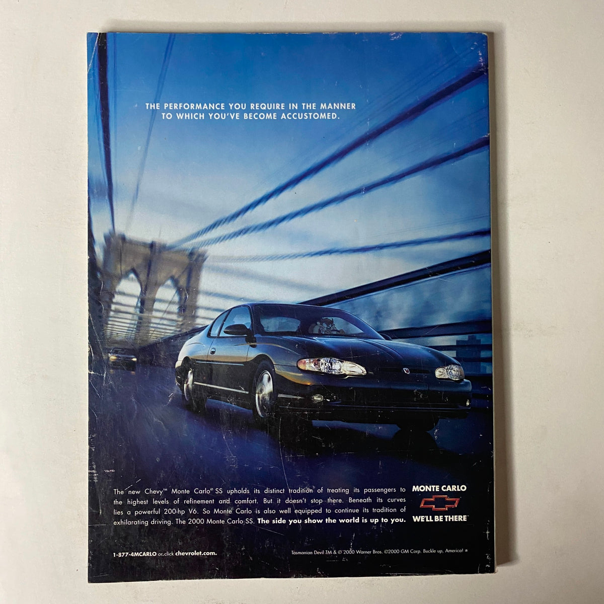 Back cover of Mode Magazine September 2001 advertising the Chevrolet Monte Carlo with an image of the car crossing a bridge, promoting luxury and performance.