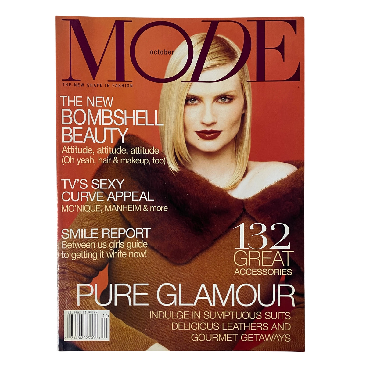 Cover of Mode Magazine, October 2001, featuring 'The New Bombshell Beauty' theme and model with glamorous hair and make-up, highlighting fashion trends and accessories.