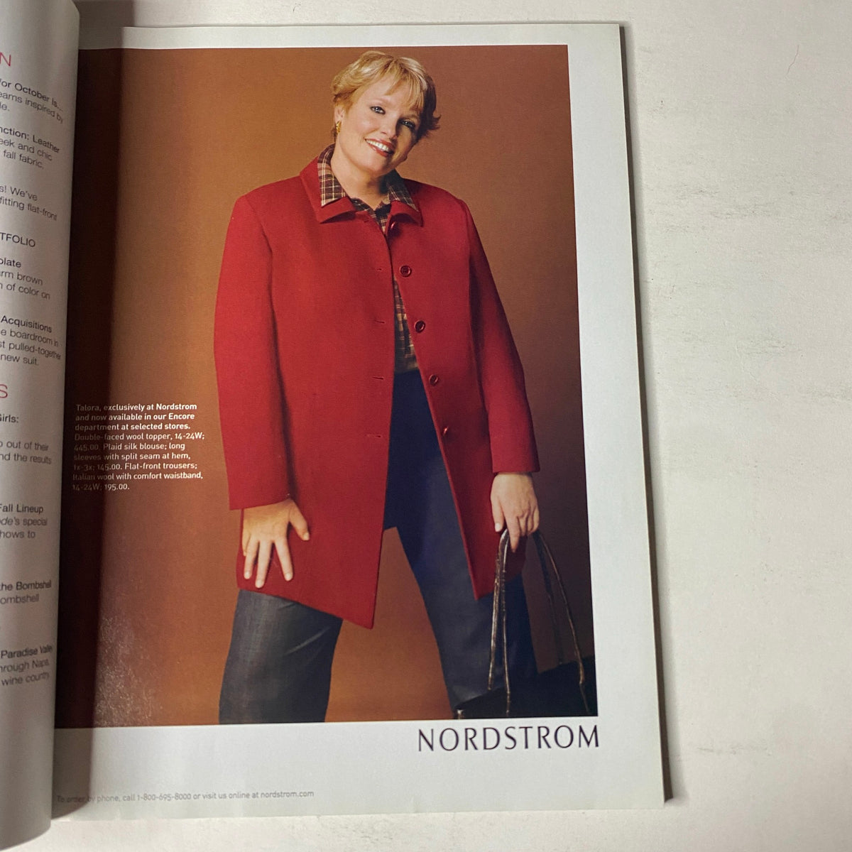 Fashion editorial image from Mode Magazine, October 2001, showcasing a model in a stylish red coat, promoting Nordstrom's fashion offerings.