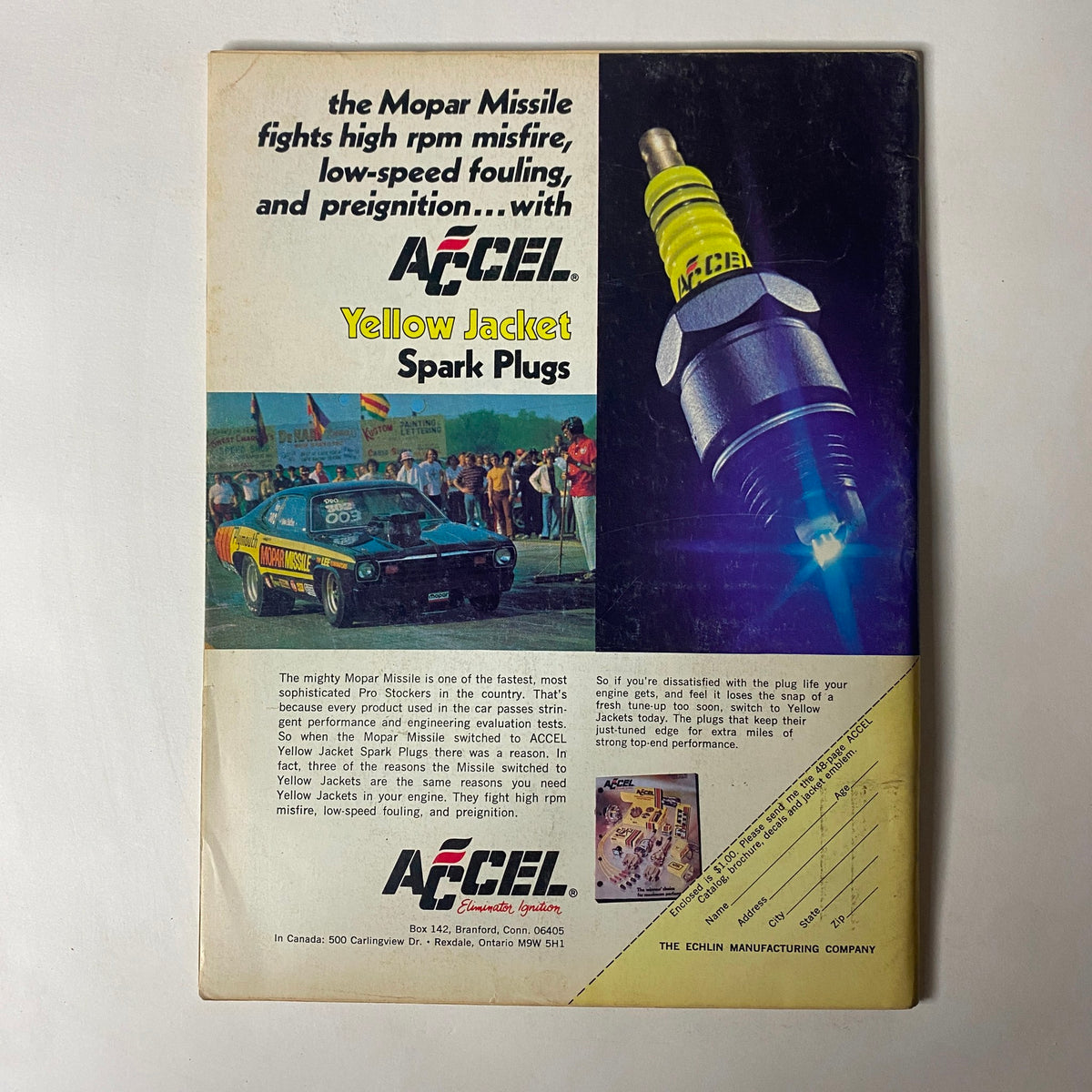 Back cover of Car Craft Magazine August 1973 displaying an advertisement for Accel Yellow Jacket Spark Plugs, aimed at enhancing vehicle performance.