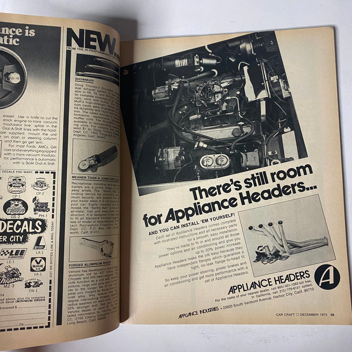 Advertisement page from Car Craft Magazine December 1973 showcasing appliance headers, aimed at car enthusiasts with a detailed graphic of engine components.