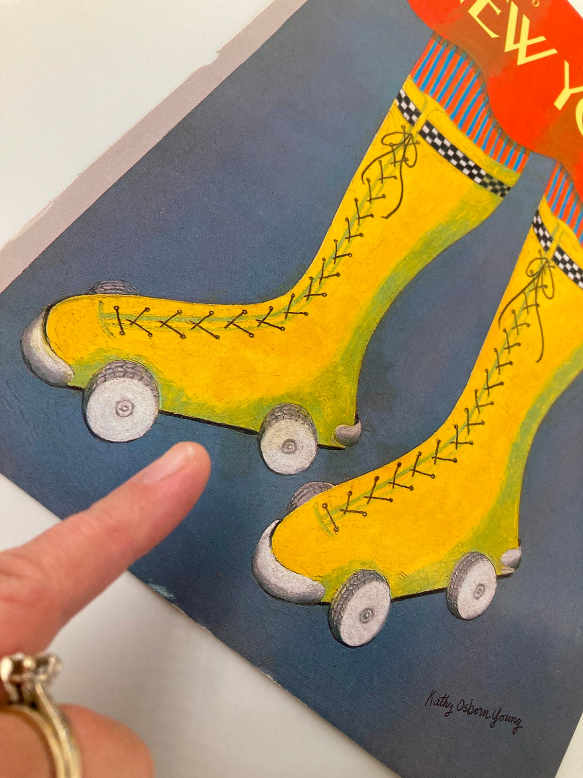 Detail of the COVER ONLY The New Yorker October 22 1990 Wheel Socks by Kathy Osborn Young, showcasing whimsical yellow roller socks with wheels, illustrating the unique artistic style of Kathy Osborn Young.