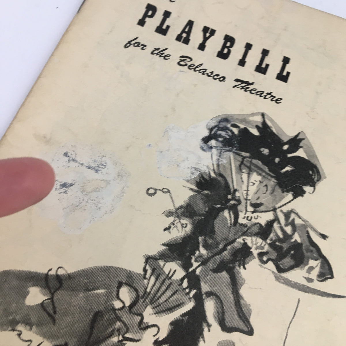 Close-up of the cover of the 1949 Playbill for The Madwoman of Chaillot, highlighting wear and age marks.