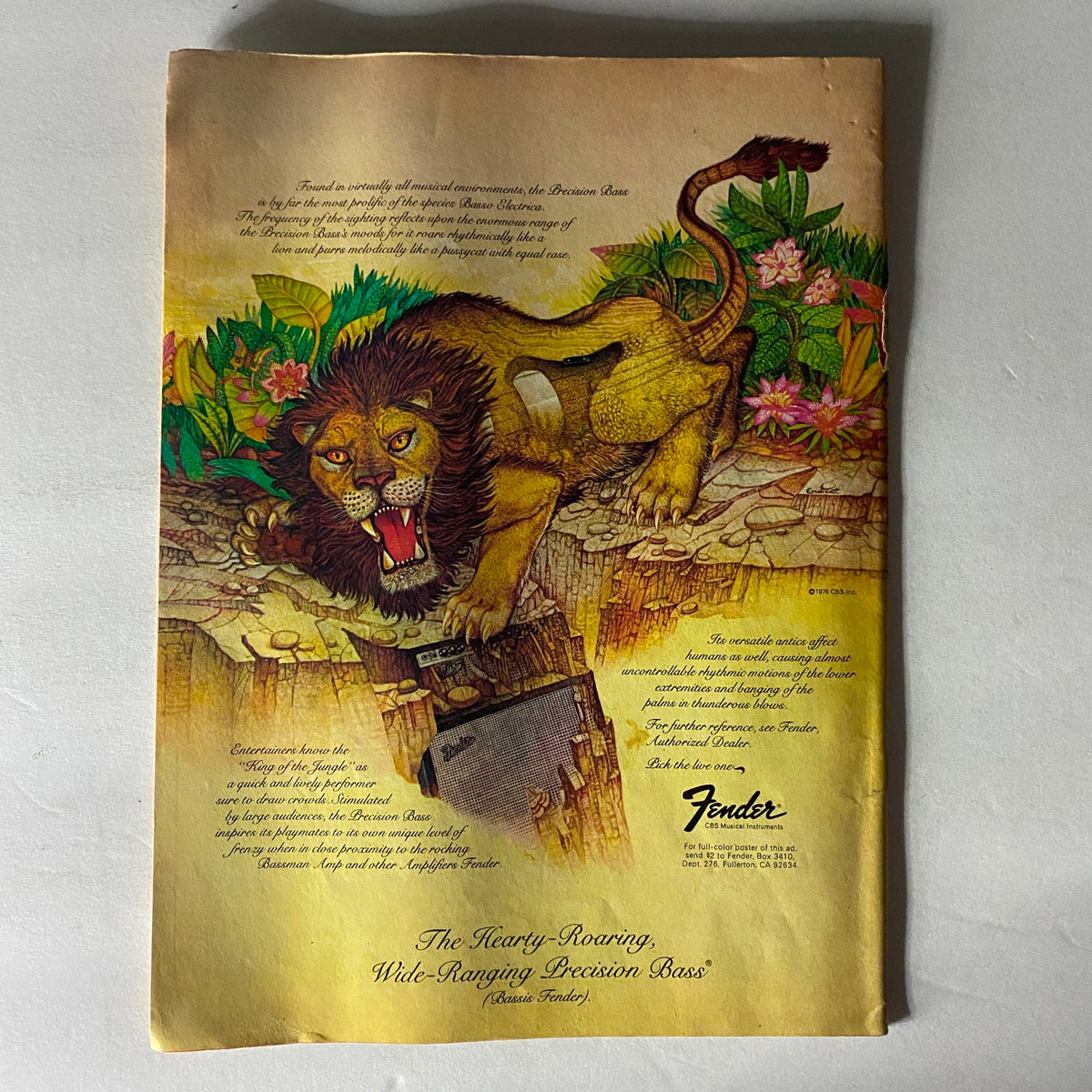 Vintage advertisement for Fender Precision Bass featuring a roaring lion, showcasing musical instruments and vibrant colors, from the VTG Circus Magazine September 29, 1977 with Keith Richards centerfold.
