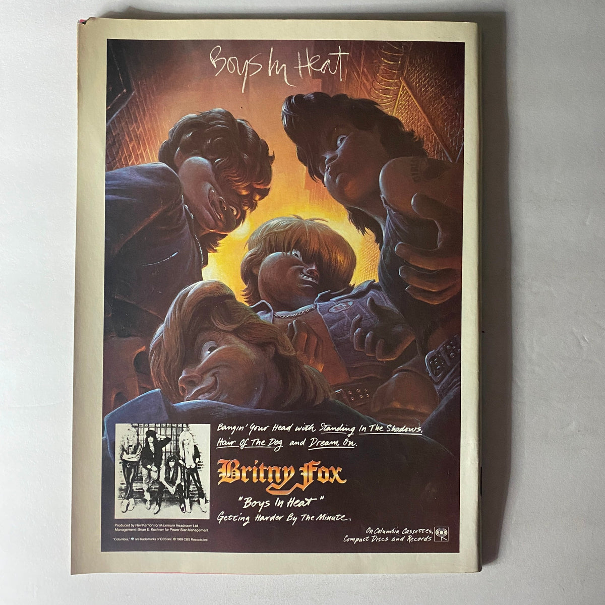 Vintage advertisement featuring the phrase 'Boys In Heat' from the RIP Magazine February 1990 issue, showcasing the music group Britny Fox along with iconic imagery reflective of the rock scene in the early '90s.