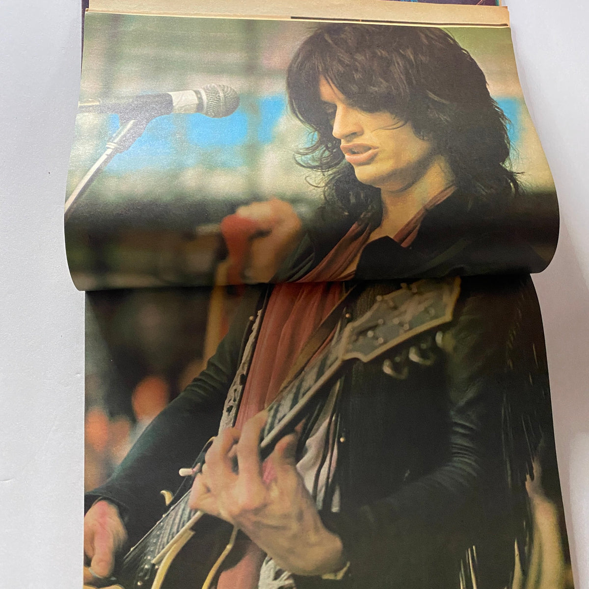 VTG Hit Parader Magazine December 1977 featuring Nick Jagger with a poster, showcasing a close-up image of a musician performing with a guitar.