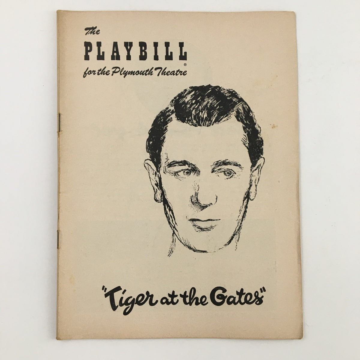 Cover of the 1955 Playbill for The Plymouth Theatre's production of Tiger At The Gates by Harold Clurman, featuring an illustration of a man.
