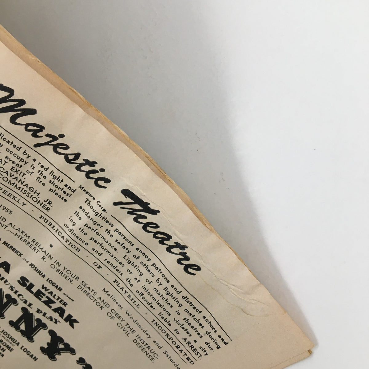 Side angle of the 1955 Playbill for Fanny, showcasing the Majestic Theatre logo and condition of the edge.