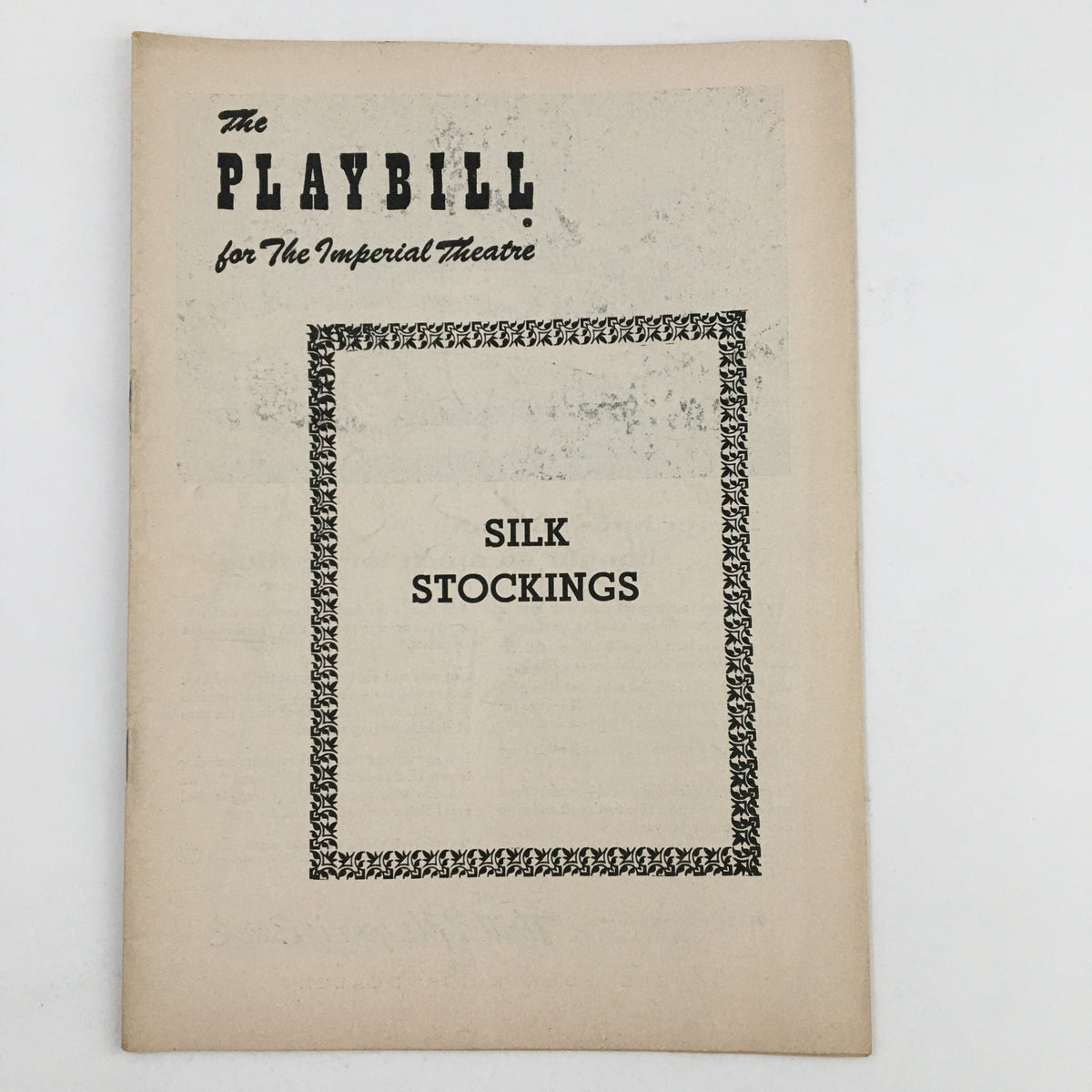 Front cover of the 1955 Playbill for The Imperial Theatre featuring Silk Stockings by Cole Porter, showcasing a vintage design.