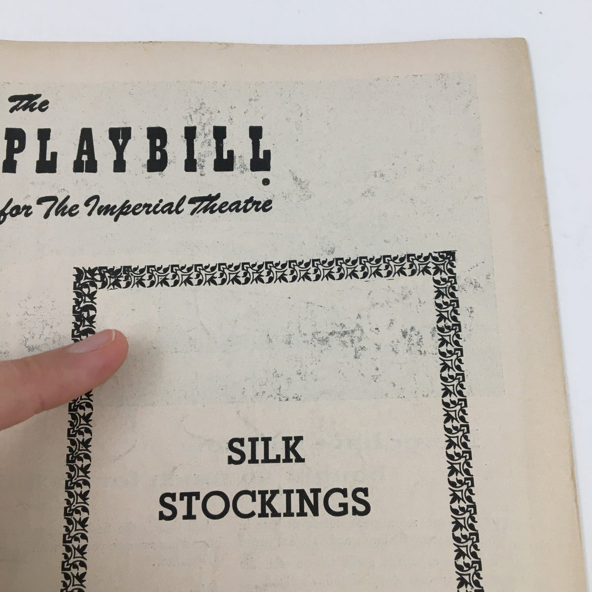 Close-up view of the top section of the 1955 Playbill for The Imperial Theatre, highlighting the title Silk Stockings and emphasizing the classic typography.
