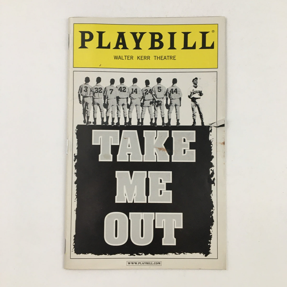 2003 Playbill for Take Me Out at the Walter Kerr Theatre, featuring the play title prominently with a black and white graphic of baseball players.