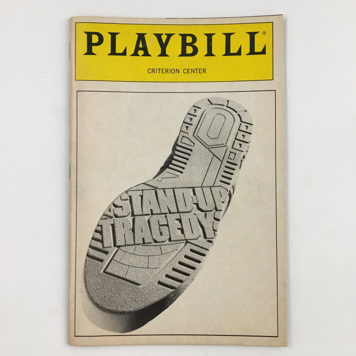 1990 Playbill Criterion Center Stage Right featuring Stand-Up Tragedy by Bill Cain, showcasing a bold cover design with the title embossed on a shoe print.