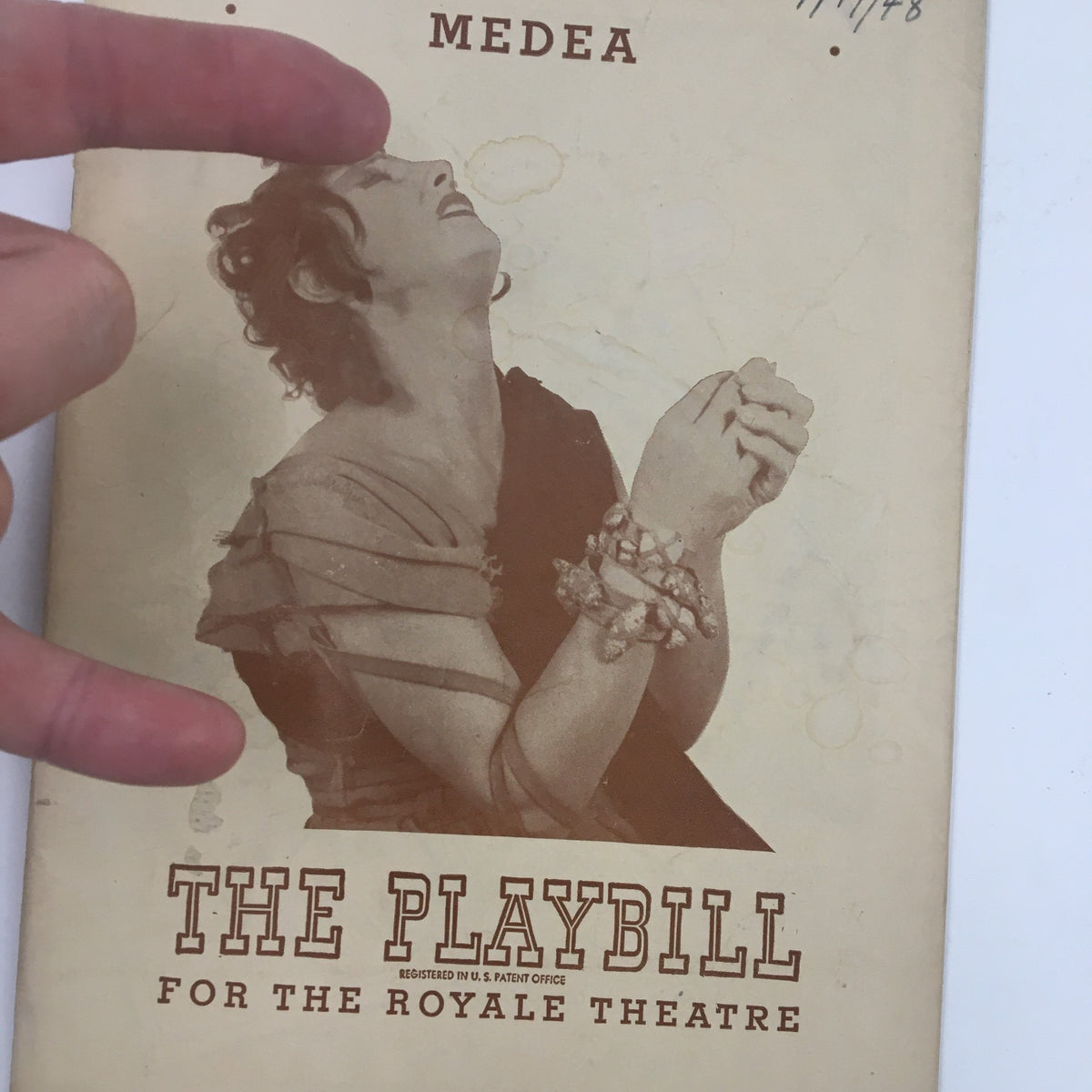 Close-up view of the 1948 Playbill for Medea at the Royale Theater, showcasing Judith Anderson's portrayal with detailed artwork and theatrical details.