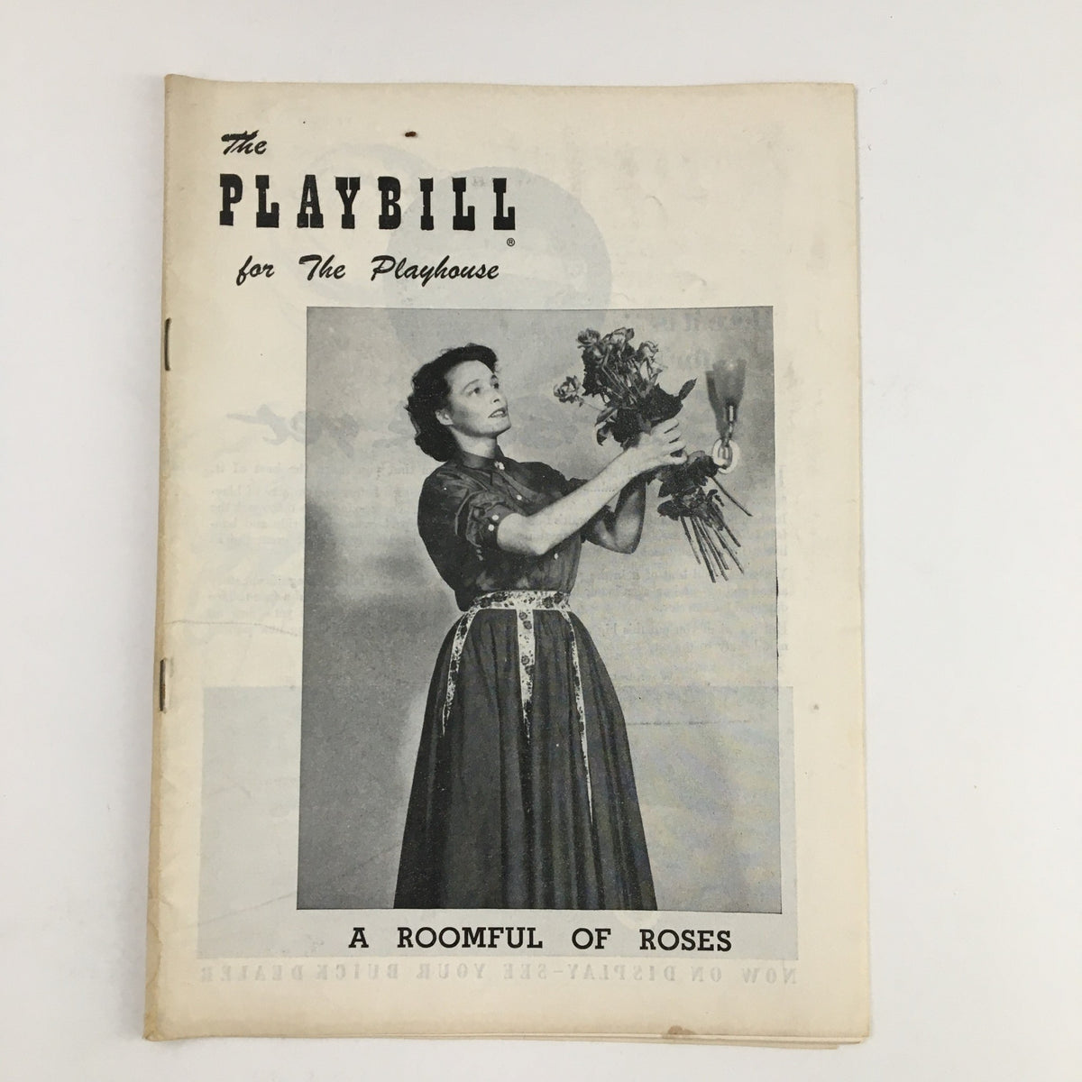 1955 Playbill featuring Patricia Neal in A Roomful of Roses, showcasing a vintage black and white photograph of a woman holding flowers, symbolizing mid-century theater history.
