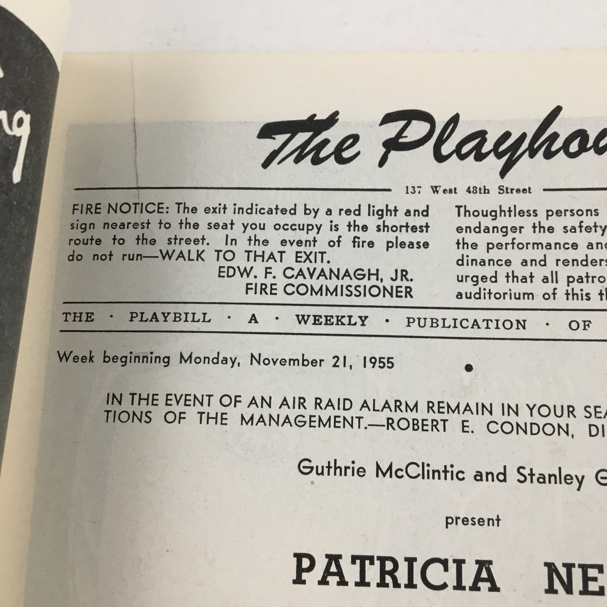 Interior page of the 1955 Playbill from The Playhouse, announcing Patricia Neal in A Roomful of Roses with fire safety instructions and production details.