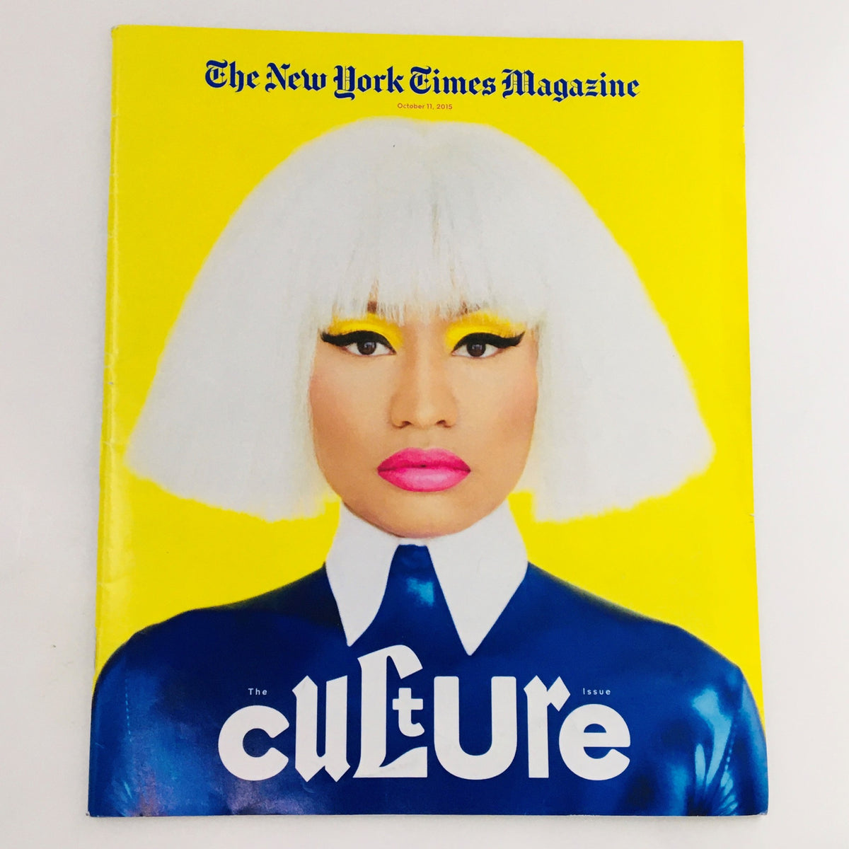 The New York Times Magazine October 11, 2015, featuring Nicki Minaj on the cover, highlighting cultural themes with her striking visual style and vibrant yellow background.