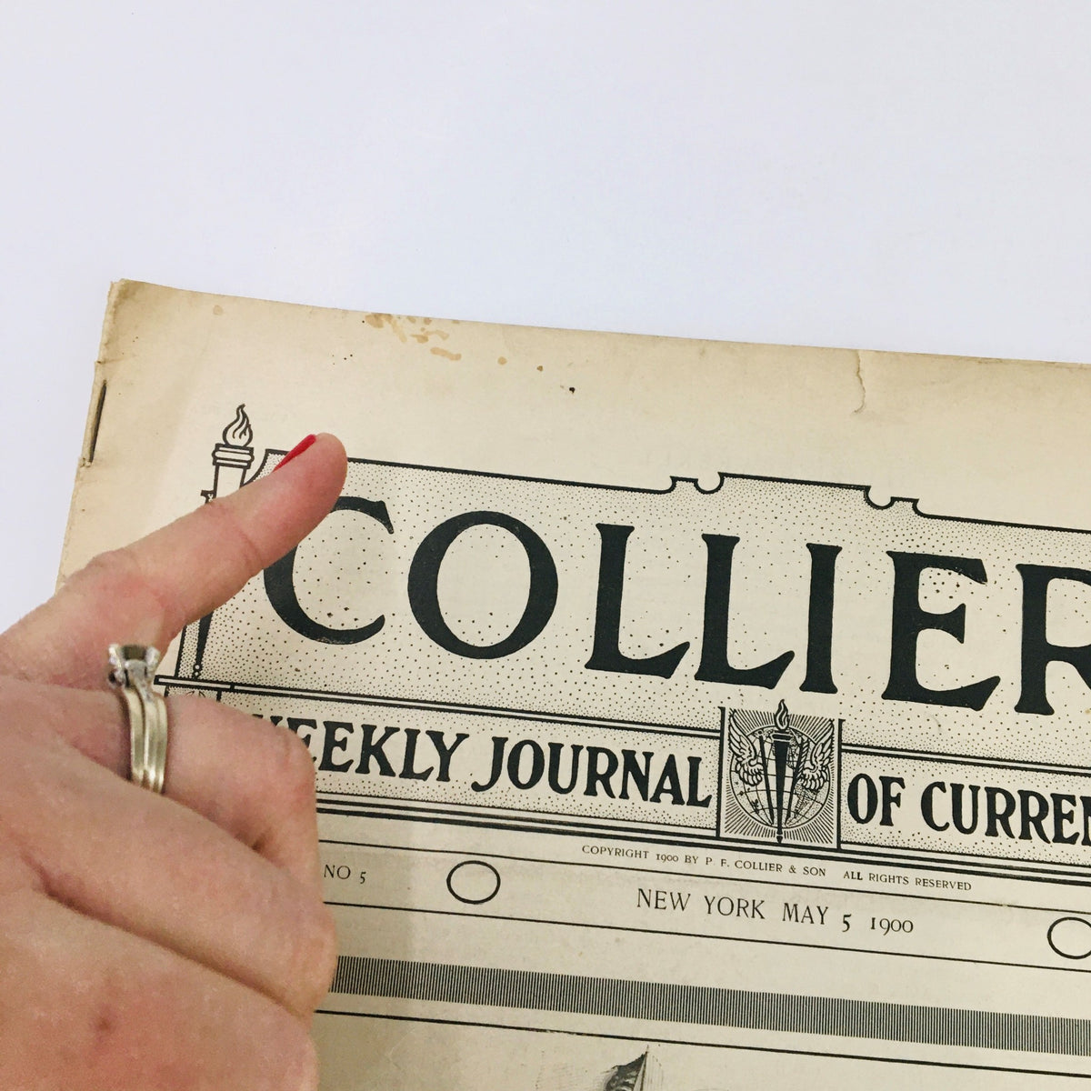Cover of Collier's Weekly Journal from May 5, 1900 titled 'Off For The World's Fair', showing the magazine's logo and some wear consistent with its age.