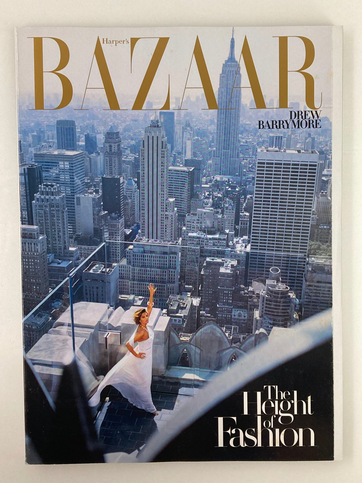 Harper's Bazaar Magazine February 2007 cover featuring Drew Barrymore in front of a skyline, showcasing the height of fashion.