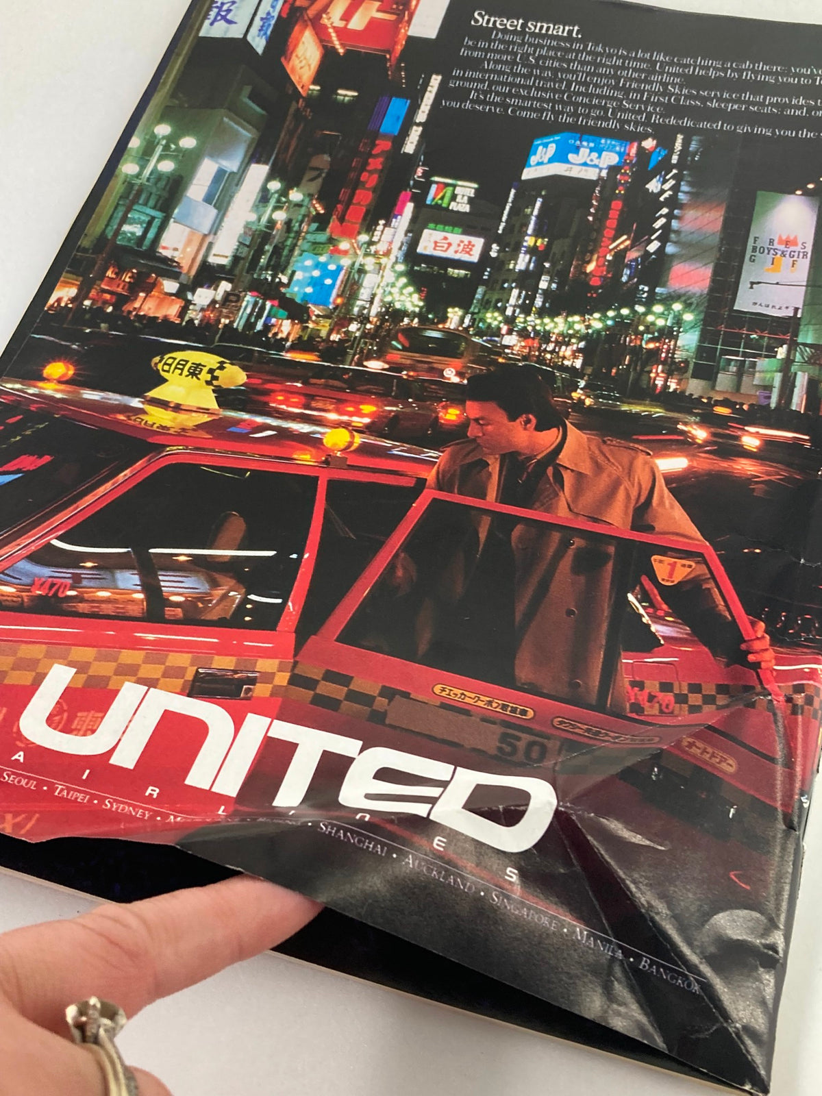 Cover of The New Yorker magazine dated March 14, 1988, featuring rooftop illustration by Arthur Getz with a vibrant nighttime cityscape and a United Airlines advertisement.
