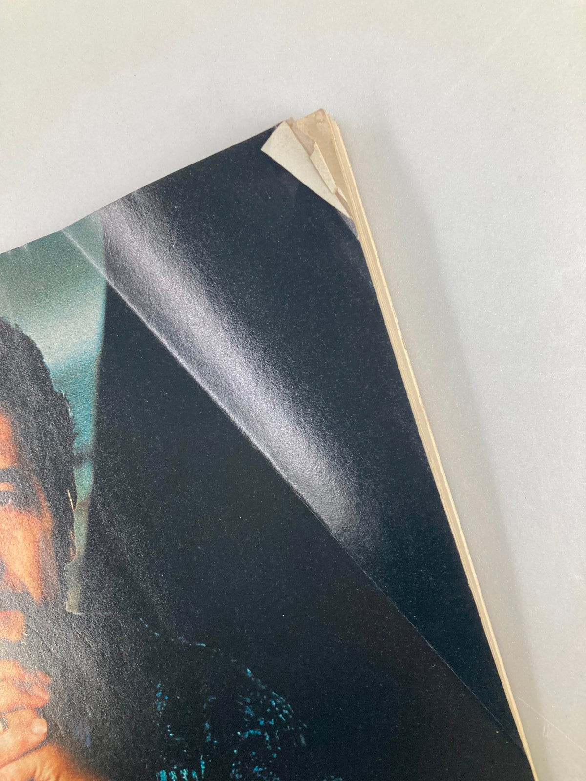 Side view of The New Yorker Full Magazine May 15, 1995, highlighting wear and creases on the cover, featuring a colorful photograph.