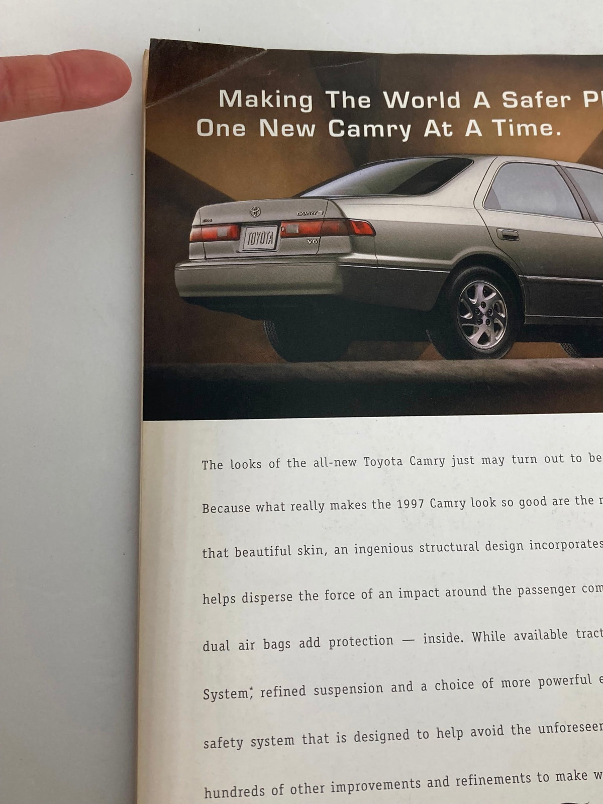 Detail from The New Yorker Full Magazine January 13, 1997 showcasing an advertisement for the 1997 Toyota Camry, emphasizing safety features and design.